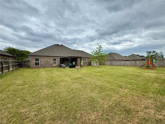335 Point W, Conway, AR 72034 - view of yard with a fenced backyard and a playground