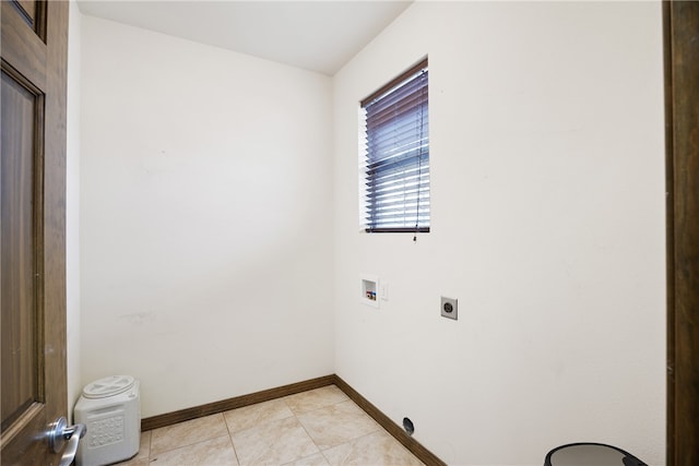 279 Eagle Cove Rd, Lamar, AR 72846 - laundry area with hookup for a washing machine, hookup for an electric dryer, baseboards, and light tile patterned floors