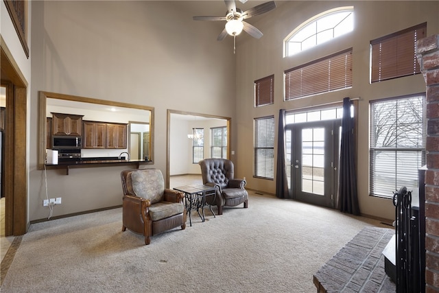 279 Eagle Cove Rd, Lamar, AR 72846 - living area featuring a high ceiling, light colored carpet, ceiling fan, and baseboards