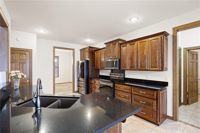 279 Eagle Cove Rd, Lamar, AR 72846 - kitchen with appliances with stainless steel finishes, a sink, baseboards, light tile patterned flooring, and recessed lighting