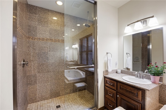 279 Eagle Cove Rd, Lamar, AR 72846 - bathroom with a tile shower, vanity, and recessed lighting