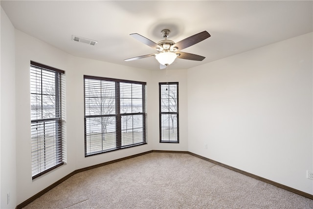 279 Eagle Cove Rd, Lamar, AR 72846 - unfurnished room featuring carpet, ceiling fan, and baseboards