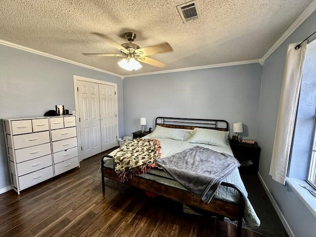 6011 River Rd, Pottsville, AR 72858 - bedroom with dark wood-style flooring, ornamental molding, a closet, a textured ceiling, and baseboards
