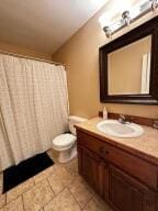 28 Angelfish Ct, Russellville, AR 72802 - full bathroom featuring tile patterned flooring, toilet, a shower with shower curtain, and vanity