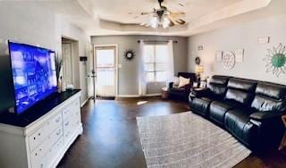 130 Willow Creek Dr, Dardanelle, AR 72834 - living room with a raised ceiling, baseboards, concrete floors, and ceiling fan
