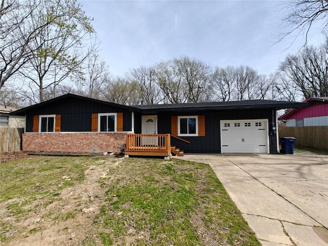 single story home with driveway, an attached garage, fence, and board and batten siding