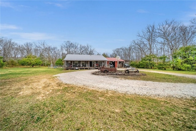 12107 Volcano Rd, West Fork, AR 72774 - view of front of house with a porch, a front lawn, and gravel driveway