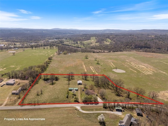 birds eye view of property with a rural view