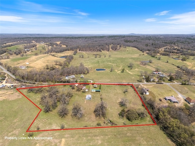 birds eye view of property featuring a rural view