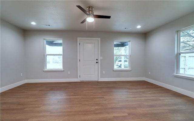 402 NE 4th Ave, Gravette, AR 72736 - unfurnished room featuring ceiling fan, wood finished floors, baseboards, and recessed lighting