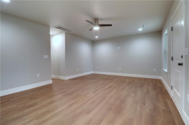 402 NE 4th Ave, Gravette, AR 72736 - empty room featuring a ceiling fan, light wood-type flooring, baseboards, and recessed lighting