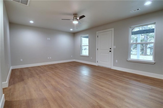 402 NE 4th Ave, Gravette, AR 72736 - unfurnished room featuring a ceiling fan, light wood-style floors, recessed lighting, and baseboards