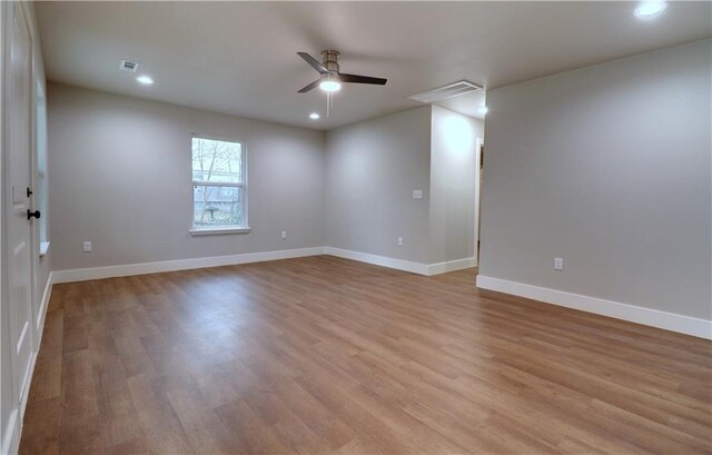 402 NE 4th Ave, Gravette, AR 72736 - spare room featuring ceiling fan, light wood-type flooring, baseboards, and recessed lighting