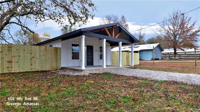 402 NE 4th Ave, Gravette, AR 72736 - view of front of property featuring covered porch