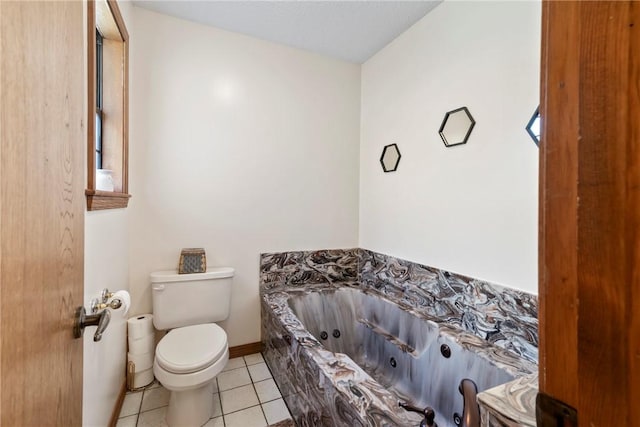 22965 Davis Valley Rd, Gentry, AR 72734 - bathroom featuring toilet, a tub with jets, and tile patterned flooring