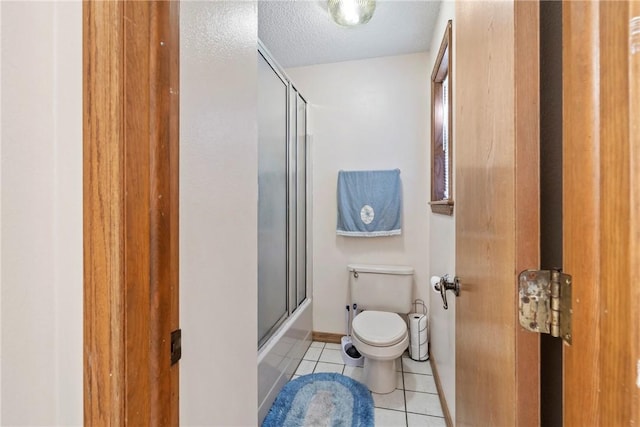 22965 Davis Valley Rd, Gentry, AR 72734 - full bath with a textured ceiling, toilet, tile patterned floors, and enclosed tub / shower combo