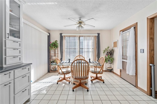 22965 Davis Valley Rd, Gentry, AR 72734 - dining room with a textured ceiling, ceiling fan, baseboards, and light tile patterned floors