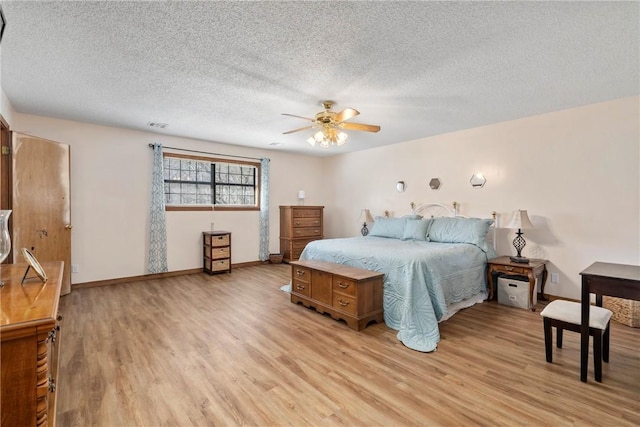 22965 Davis Valley Rd, Gentry, AR 72734 - bedroom with light wood finished floors, baseboards, visible vents, and a textured ceiling