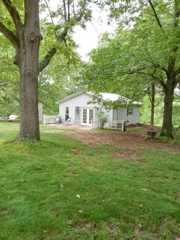 view of yard with french doors