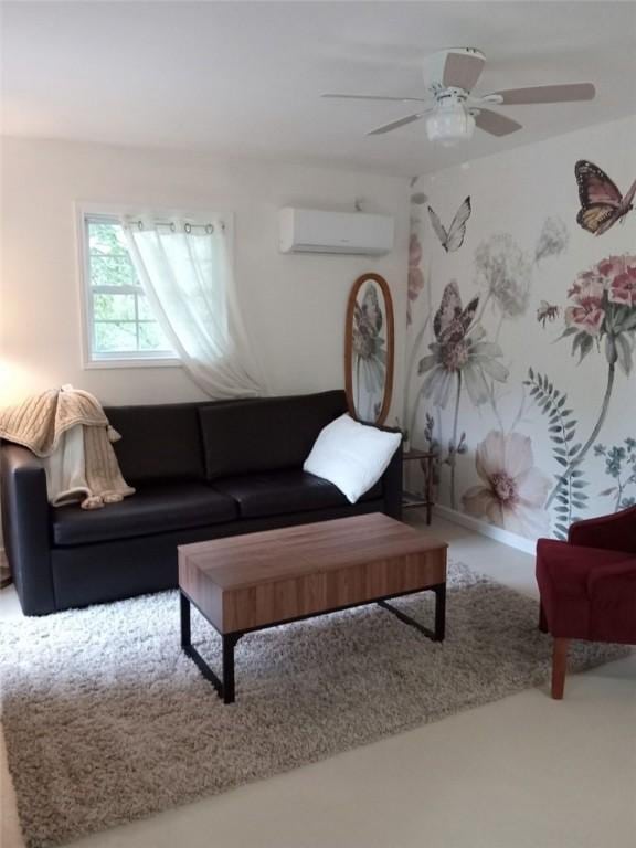 living room with baseboards, an AC wall unit, carpet flooring, and a ceiling fan