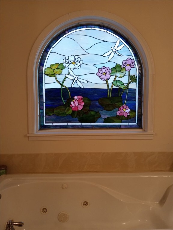 interior details featuring a whirlpool tub