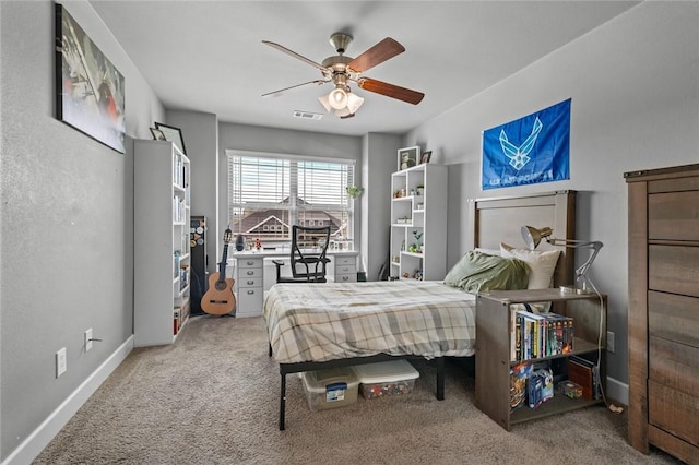 4204 SW Wheatgrass Blvd, Bentonville, AR 72713 - bedroom with carpet flooring, baseboards, and ceiling fan