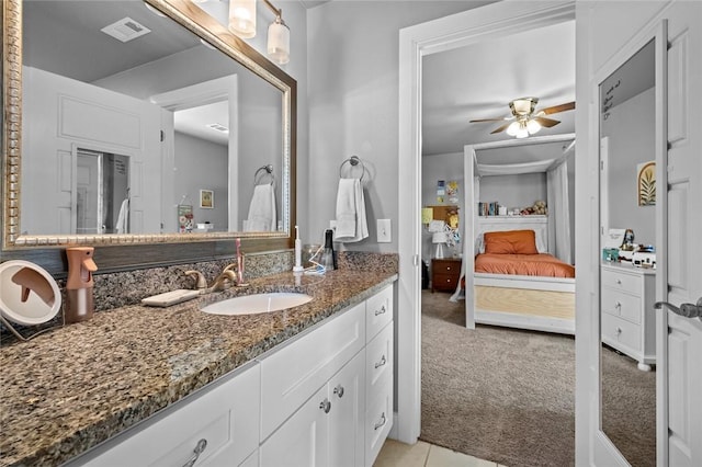 4204 SW Wheatgrass Blvd, Bentonville, AR 72713 - bathroom featuring ensuite bath, a ceiling fan, and vanity