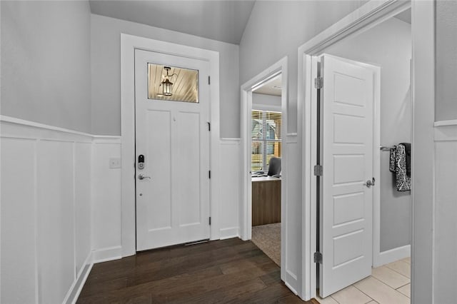 4204 SW Wheatgrass Blvd, Bentonville, AR 72713 - foyer with wainscoting, wood finished floors, and a decorative wall