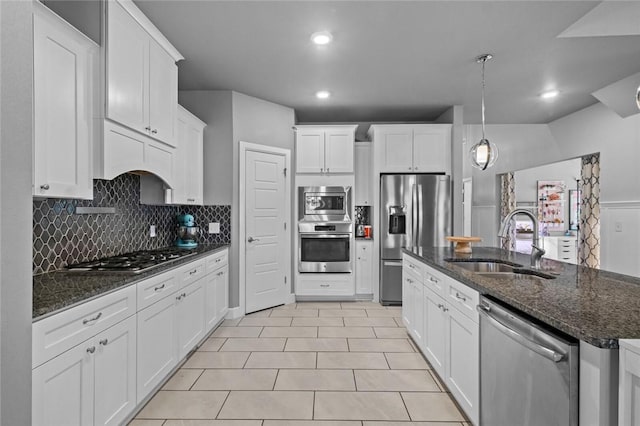 4204 SW Wheatgrass Blvd, Bentonville, AR 72713 - kitchen featuring appliances with stainless steel finishes, a sink, decorative backsplash, white cabinetry, and recessed lighting