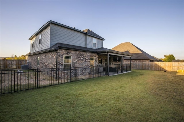 4204 SW Wheatgrass Blvd, Bentonville, AR 72713 - rear view of house with a patio, central AC unit, and brick siding