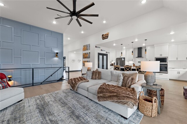 1904 NE Frost Dr, Bentonville, AR 72712 - living room with light wood-style flooring, ceiling fan, and recessed lighting