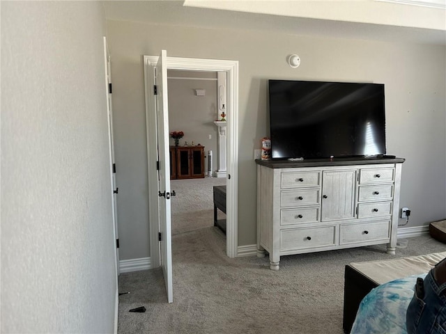 carpeted bedroom featuring baseboards