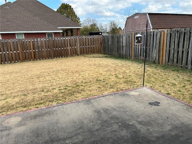 view of yard featuring a patio and a fenced backyard