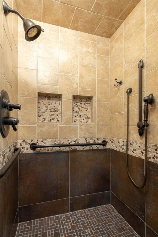 bathroom with a tile shower