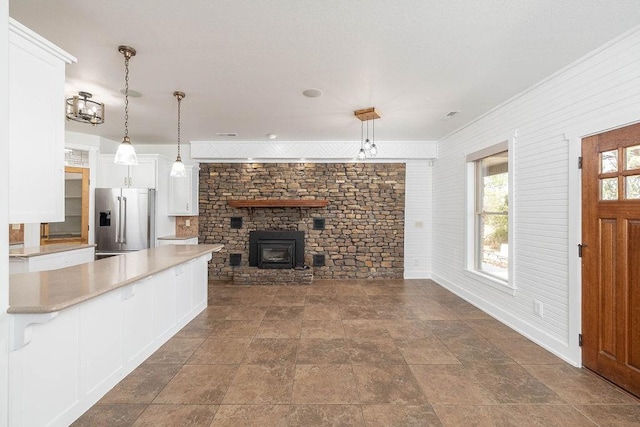 interior space featuring baseboards and stone finish flooring