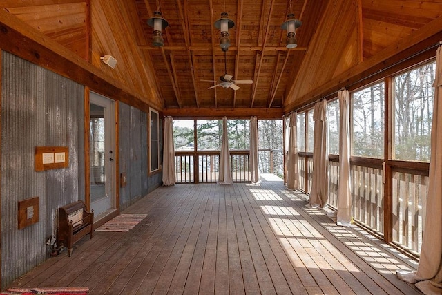 unfurnished sunroom with wood ceiling, ceiling fan, vaulted ceiling, and hardwood / wood-style flooring