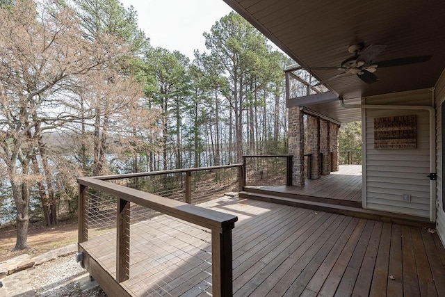 wooden terrace featuring a ceiling fan
