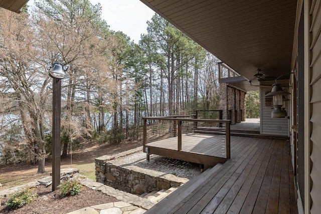 wooden terrace featuring a ceiling fan