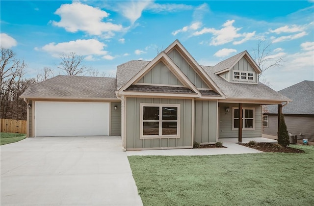 9 Beaty Ln, Bella Vista, AR 72715 - craftsman-style house with driveway, board and batten siding, a front lawn, a garage, and a shingled roof