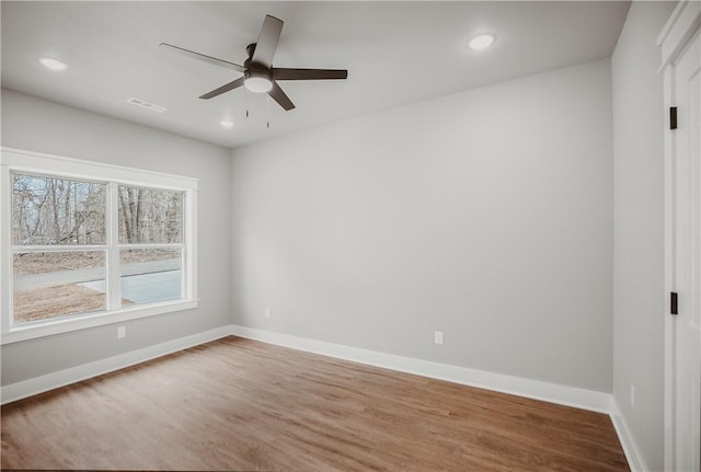 9 Beaty Ln, Bella Vista, AR 72715 - spare room with wood finished floors, a ceiling fan, and recessed lighting