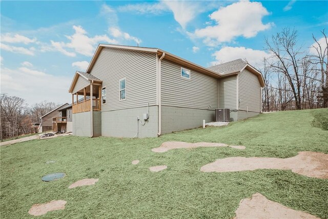 9 Beaty Ln, Bella Vista, AR 72715 - view of property exterior with cooling unit and a lawn