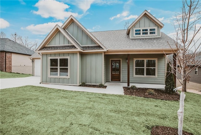 9 Beaty Ln, Bella Vista, AR 72715 - view of front facade with a shingled roof, driveway, board and batten siding, and a front lawn