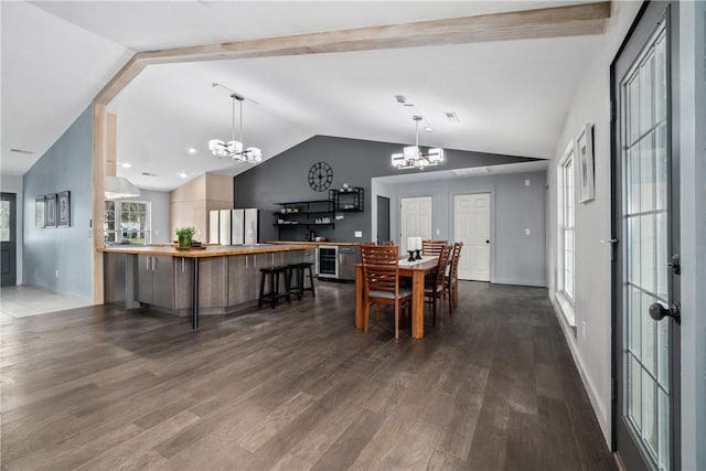 11300 Spring Mountain Dr, Farmington, AR 72730 - dining area with dark wood-style flooring, a notable chandelier, wine cooler, and lofted ceiling