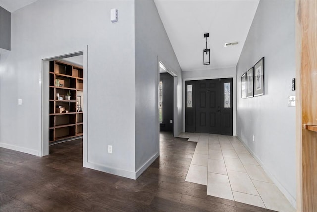 11300 Spring Mountain Dr, Farmington, AR 72730 - entrance foyer with wood finished floors, high vaulted ceiling, baseboards, and visible vents