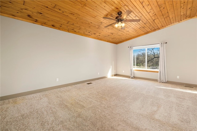 carpeted spare room featuring wood ceiling, ceiling fan, baseboards, and vaulted ceiling