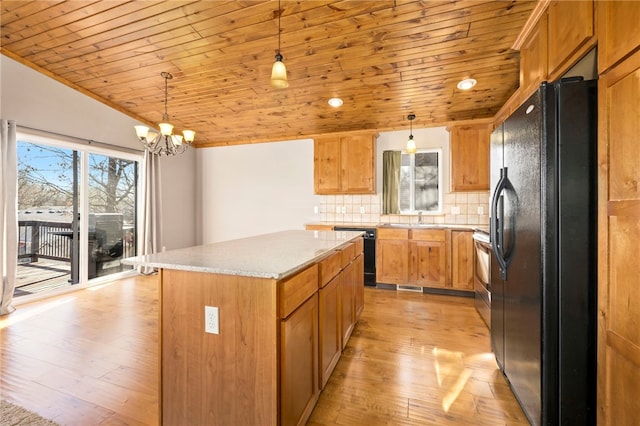 kitchen with a sink, wooden ceiling, black appliances, and light wood-type flooring