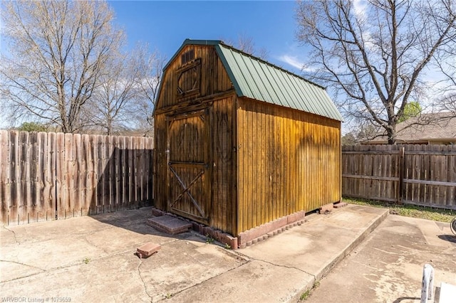 view of shed featuring a fenced backyard