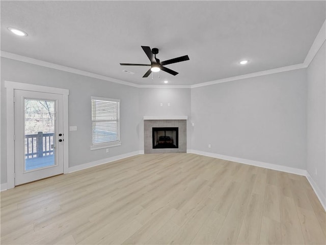 6 Osborne Ln, Bella Vista, AR 72715 - unfurnished living room featuring ceiling fan, light wood-style floors, baseboards, crown molding, and a fireplace