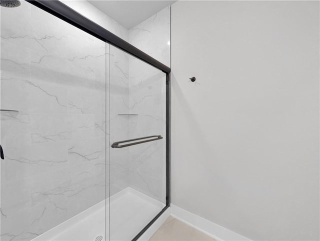 6 Osborne Ln, Bella Vista, AR 72715 - bathroom featuring a marble finish shower, marble finish floors, and baseboards