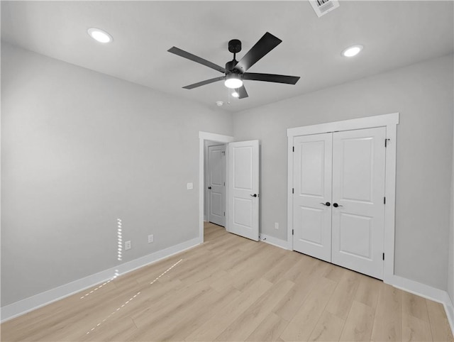 6 Osborne Ln, Bella Vista, AR 72715 - unfurnished bedroom with light wood-type flooring, baseboards, recessed lighting, a ceiling fan, and a closet